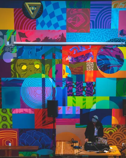 A DJ performs at Modist Brewing