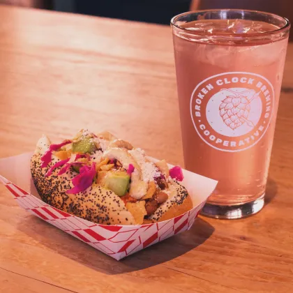 A NA Seltzer and a hot dog at Broken Clock Brewing Cooperative
