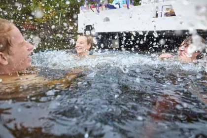 A group of friends go swimming in Voyageurs National Park