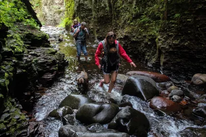 A family hikes along Kadunce River