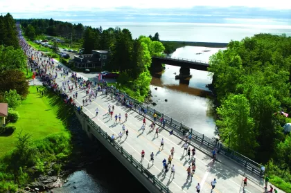 Grandma's Marathon runners cross Knife River in Duluth