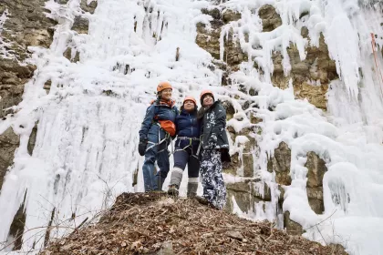 Three friends gather at the bottom of Winona's Ice Climbing Park
