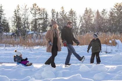 A family on the Riverbend Skate Path in Warroad