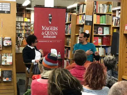 Poet Ross Gay speaks with radio host Lissa Jones at Magers &amp; Quinn