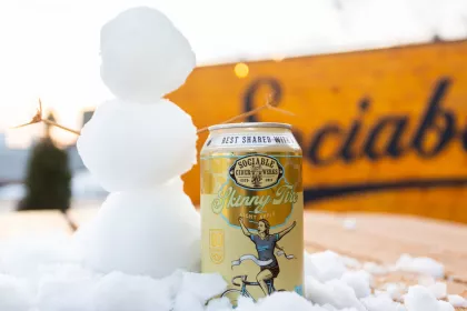 Someone makes a snowman on Sociable Cider Werks' heated patio