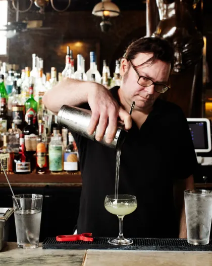 A bartender pours a cocktail at WA Frost &amp; Company