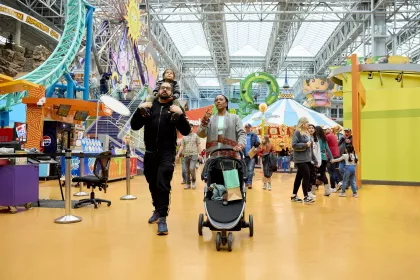 A family walks around Nickelodeon Universe at Mall of America