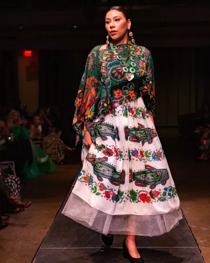 A fashion show features the work of IamAnishinaabe designer Delina White