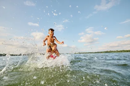 A couple kids play in Bde Maka Ska