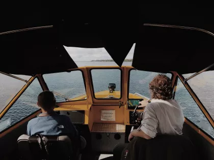 Two men take a boat through Voyageurs National Park
