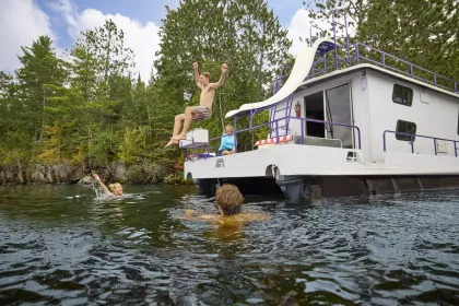 A family swims near their houseboat at Voyageurs National Park