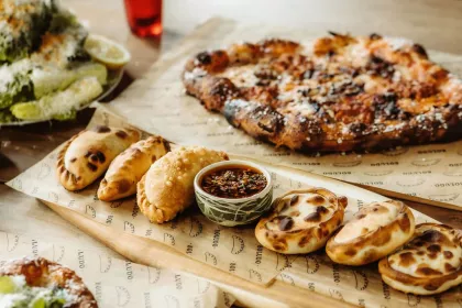 Empanadas and pizza at Boludo