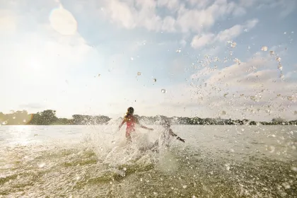 A family at Bde Maka Ska's beach in Minneapolis