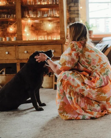 A customer pets the dog at The Foundry Home Goods