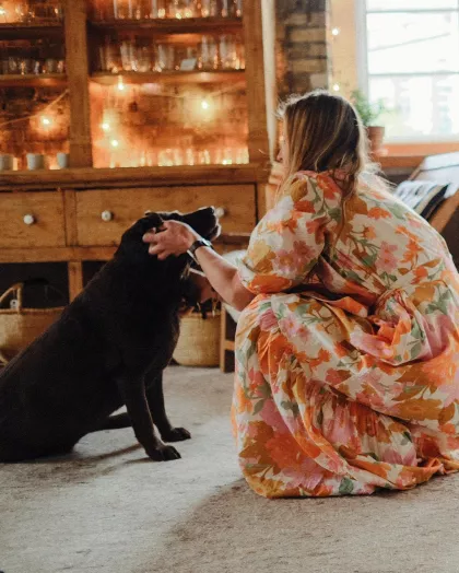 A customer pets the dog at The Foundry Home Goods