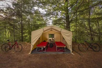 A tent and a couple bikes at True North Basecamp