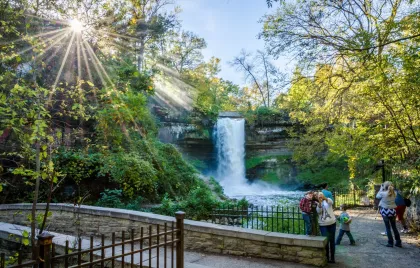 Families pose in front of Minnehaha Falls