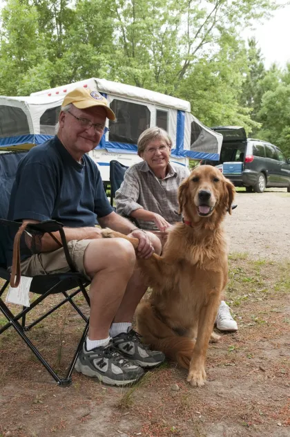 A couple camping with their dog at Itasca State Park
