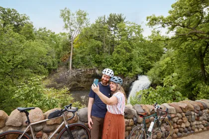 A couple bikers snap a selfie near Minnehaha Falls