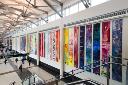 Anne Labovitz's "122 Conversations: Person to Person, Art Beyond Border" installation at MSP Airport