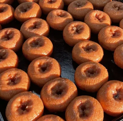 A sheet of freshly baked donuts at DC Donuts Dream Cafe