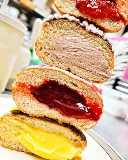 A stack of stuffed Paczki doughnuts at Hanisch Bakery