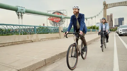 A couple bikers along the Hennepin Avenue Bridge in Minneapolis