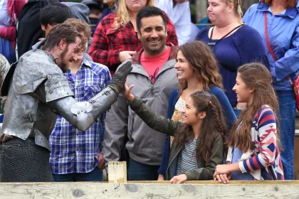 A family says hello to a knight at the Minnesota Renaissance Festival