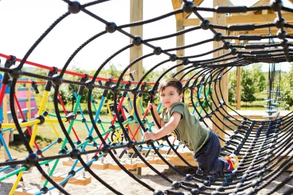 A toddler on the playground at Apple Jack Orchards