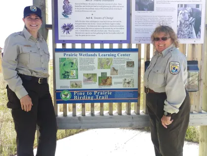 A couple rangers at the Prairie Wetlands Learning Center