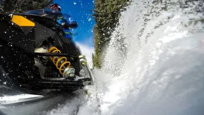 A snowmobiler kicks up snow in the Leech Lake area