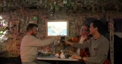 A group of friends eat Juicy Lucys at The Nook