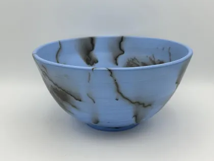 A raku bowl made by Carol Danielson, one of Fired up Studios' featured artists