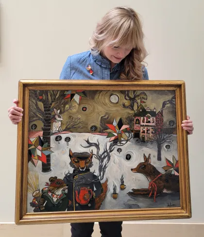 Artist Dawn Candace Silvernagle holds one of her DC Ice pieces