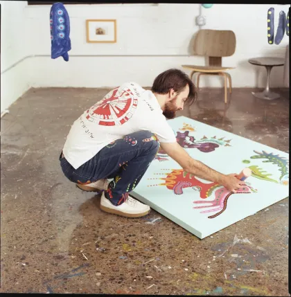 Sander Kolodziej makes an abstract painting at his Northrup King studio