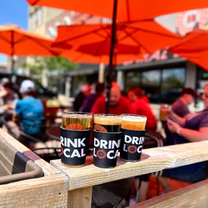 A trio of pints on a patio at Spiral Brewery