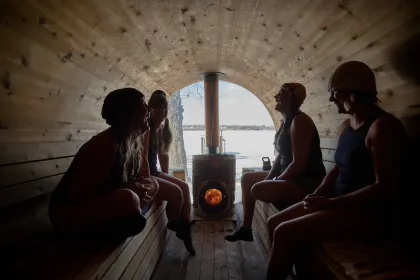 Friends laugh while experiencing Sauna Camp Minnesota