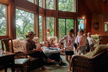 A family hangs out inside their cabin at Fair Hills Resort