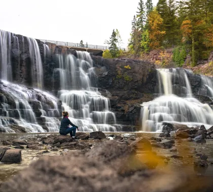 A hiker at Gooseberry Falls in Two Harbors