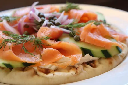 Pita bread topped with smoked salmon, cream cheese, red onions and capers at Finnish Bistro