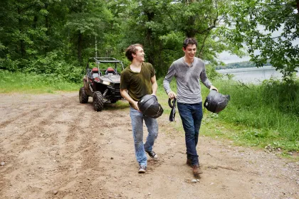 A couple of ATVers take a break from trail riding in Fort Ripley