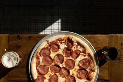 Pepperoni pizza and a beer at Broder's Cucina Italiana