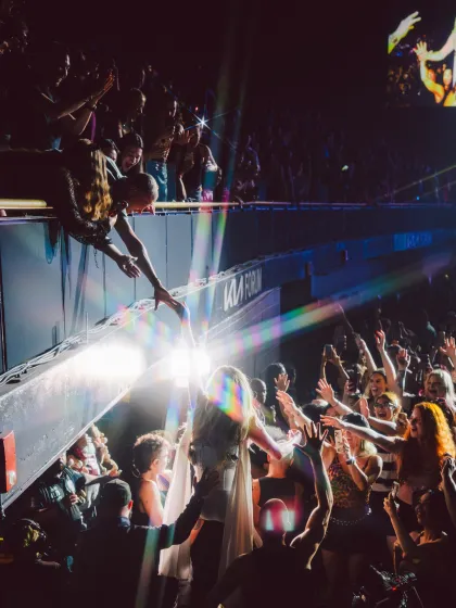 Kesha hops out in the crowd at LA's Kia Forum