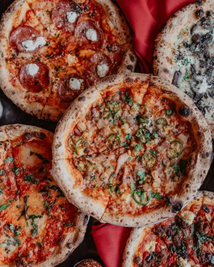Five of the featured pizzas at Red Rabbit