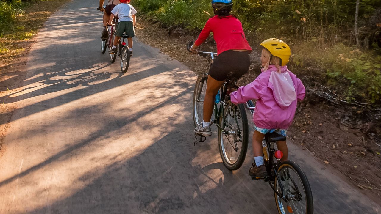 Family biking on Gitchi-Gami State Trail