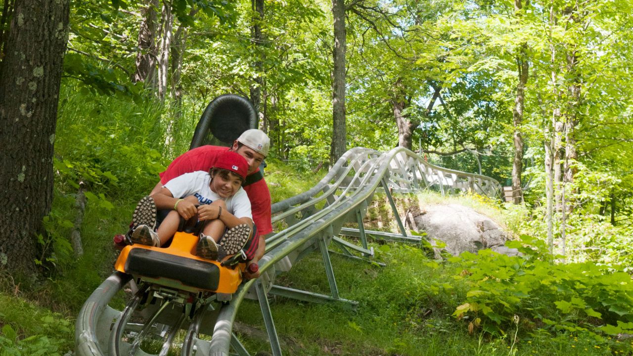 Man and son on Timber Twister ride