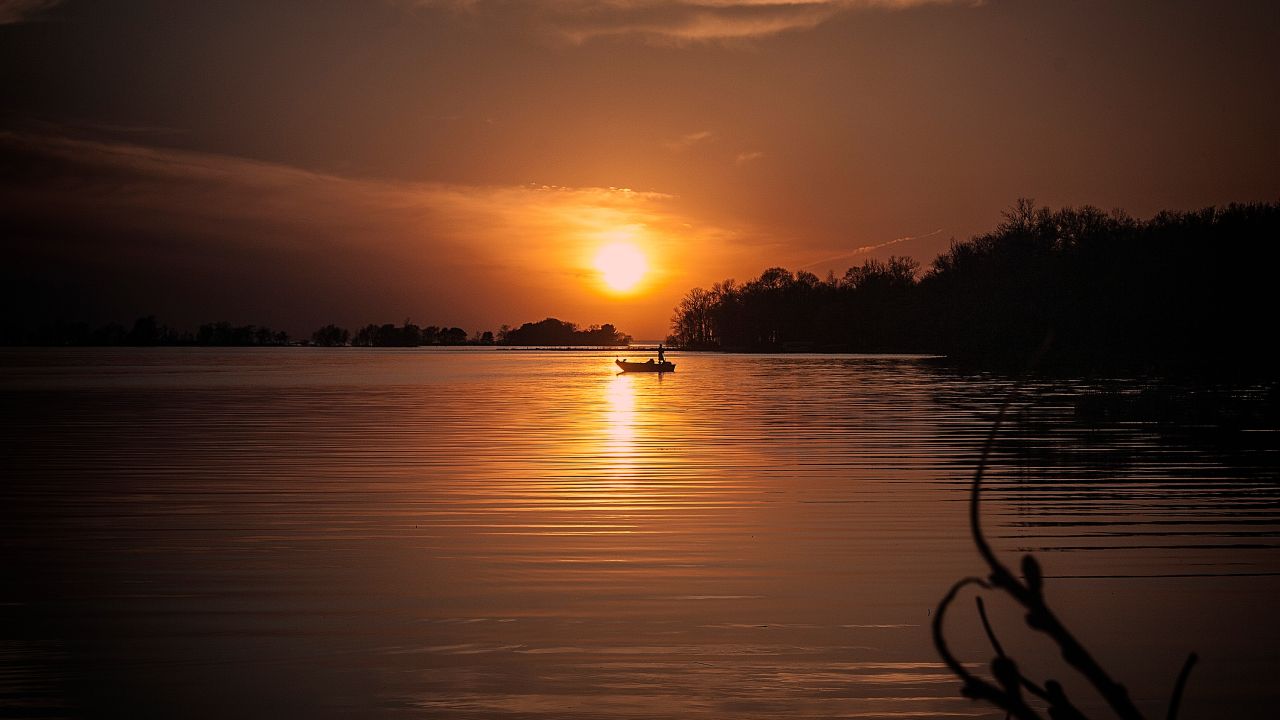 Sunset and a single boat on Lake Mille Lacs