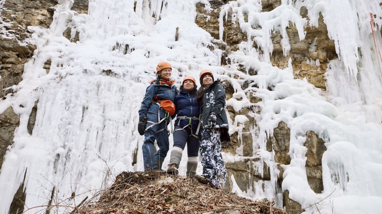Three friends gather at the bottom of Winona's Ice Climbing Park