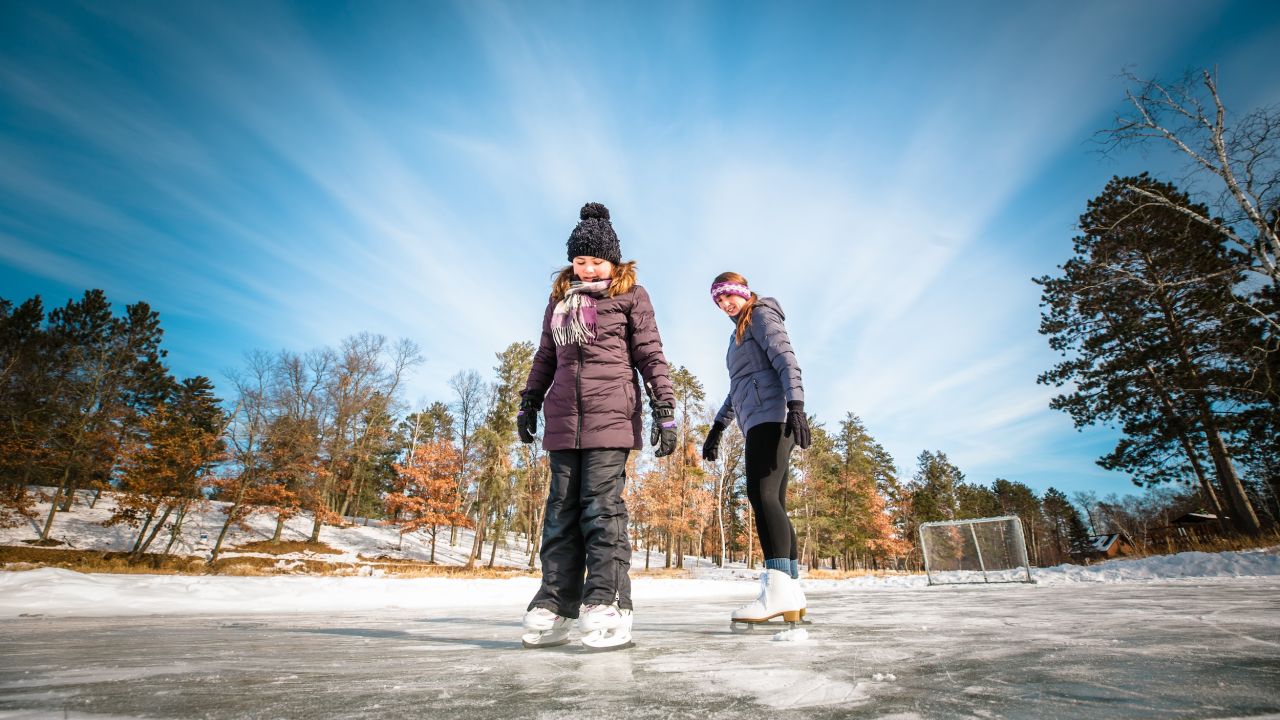 A couple ice skaters at Boyd Lodge in Crosslake