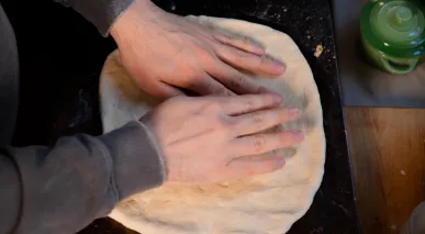 Hayden Haas kneading his pizza dough